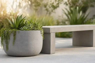 Concrete planter with succulents by bench